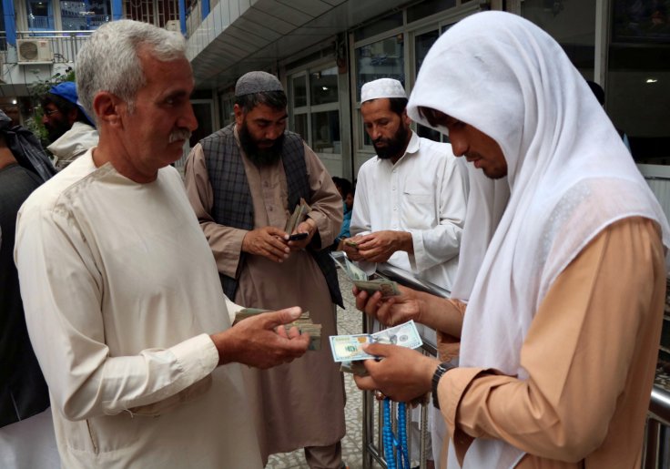 Afghan money changers gather to deal with foreign currency at a money change market in Herat province, Afghanistan June 3, 2018. Afghan money changers gather to deal with foreign currency at a money change market in Herat province, Afghanistan June 3, 2018.