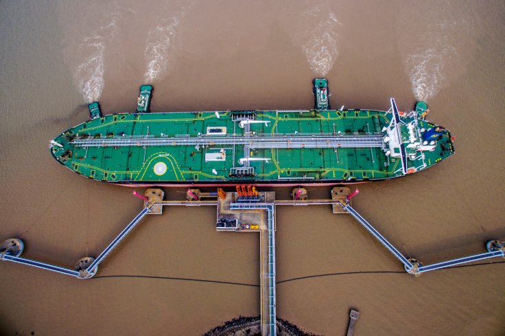 An oil tanker unloads crude oil at a crude oil terminal in Zhoushan, Zhejiang province, China July 4, 2018. Picture taken July 4, 2018. 