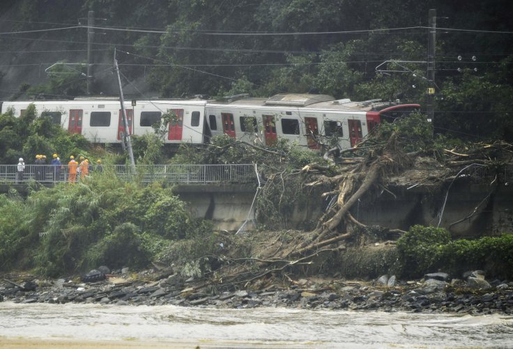 Derailed train caused by a landslide following heavy rain is seen in Karastu, southwestern Japan, in this photo taken by Kyodo July 7, 2018. 