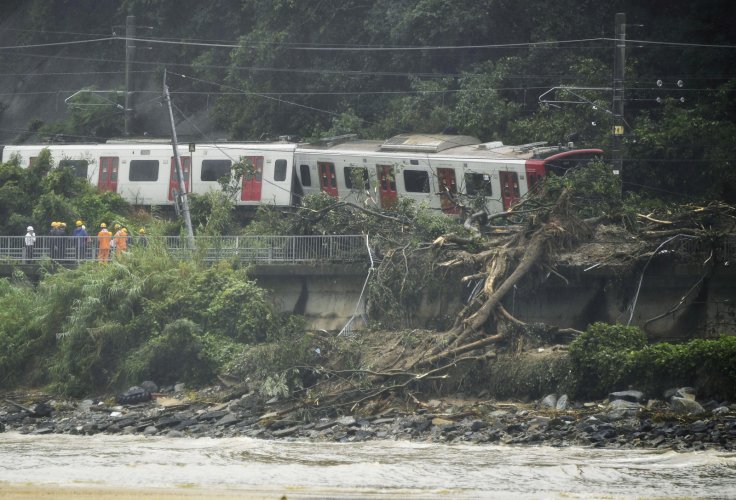 Derailed train caused by a landslide following heavy rain is seen in Karastu, southwestern Japan, in this photo taken by Kyodo July 7, 2018. Derailed train caused by a landslide following heavy rain is seen in Karastu, southwestern Japan, in this photo taken by Kyodo July 7, 2018.