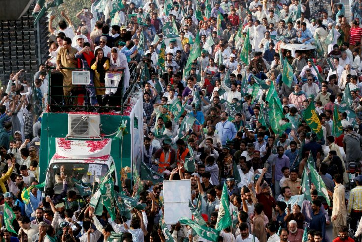 Supporters of the Pakistan Muslim League - Nawaz (PML-N) chant and march towards the airport to welcome ousted Prime Minister Nawaz Sharif and his daughter Maryam, in Lahore, Pakistan July 13, 2018.