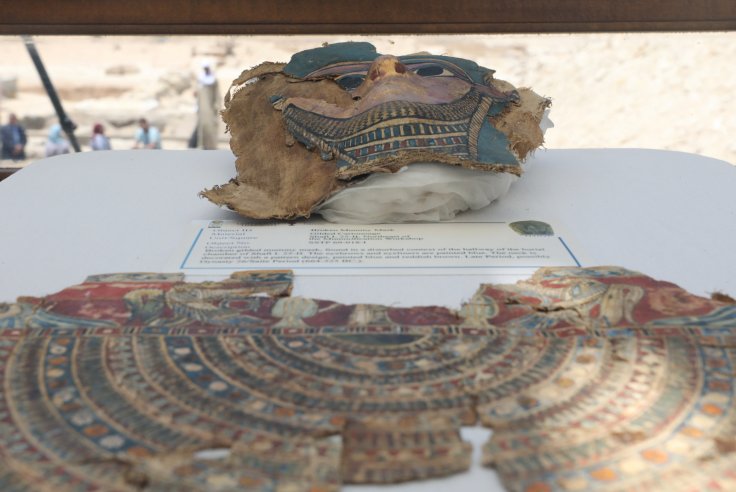 A broken mummy mask is seen inside a glass casing, on display near Egypt's Saqqara necropolis, in Giza Egypt July 14, 2018.