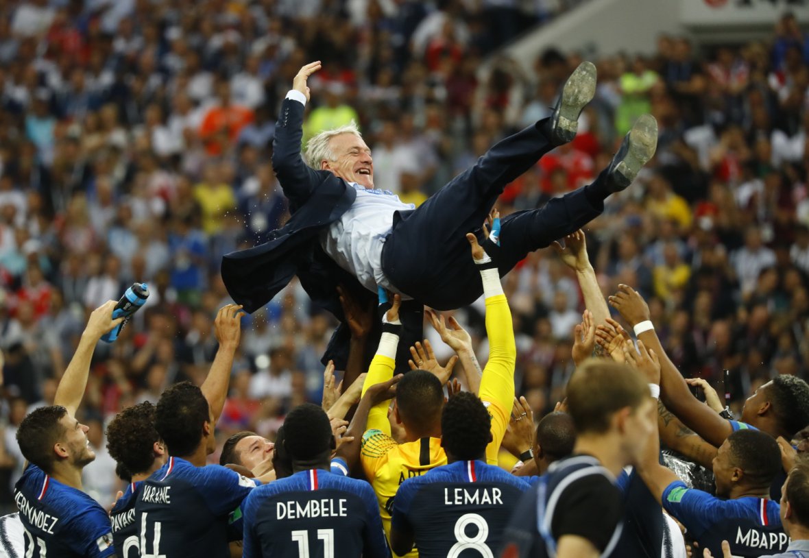 France players celebrate winning the World Cup with coach Didier Deschamps 