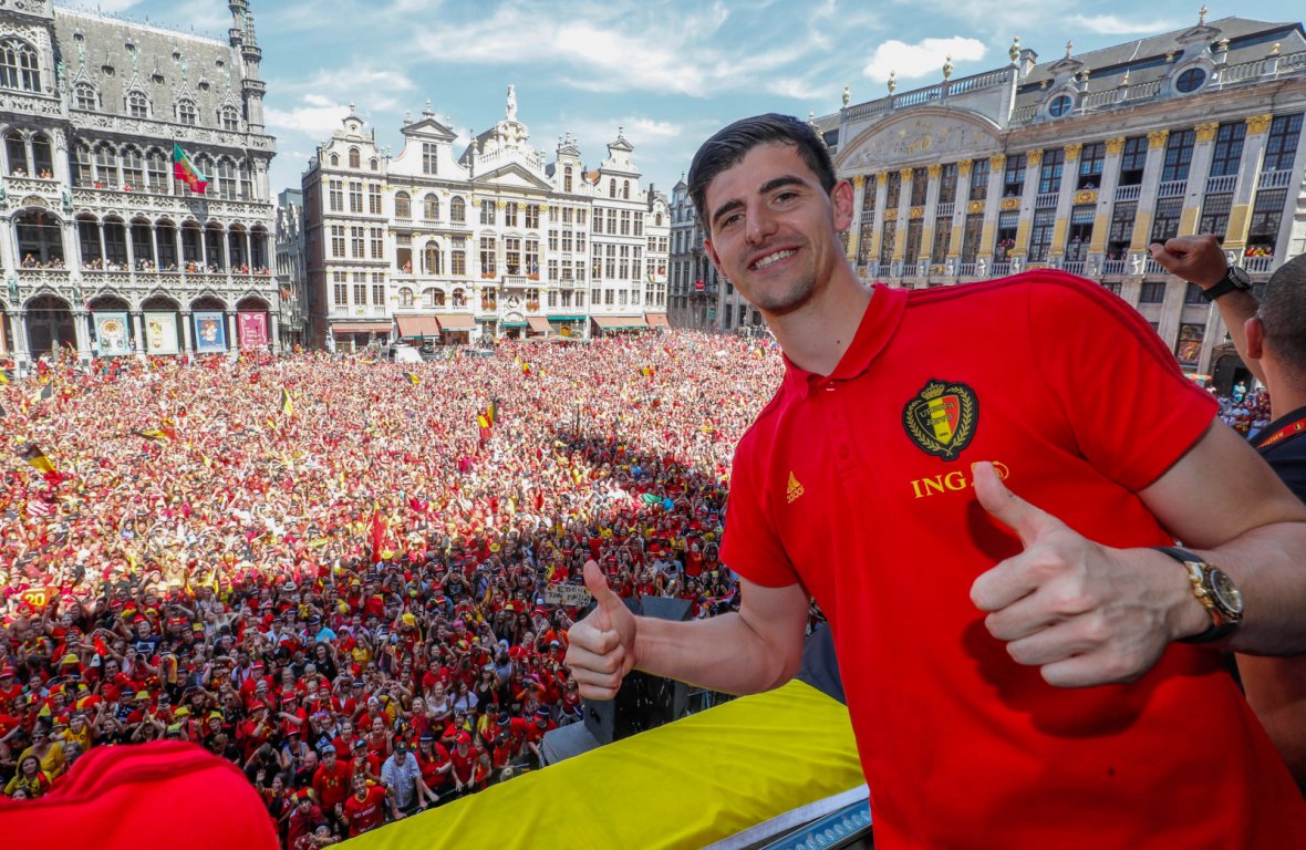 Golden Glove winner Thibaut Courtois waves to the fans while appearing on the balcony of the city hall at the Brussels' Grand Place, after taking the third place in the World Cup 2018, in Brussels, Belgium