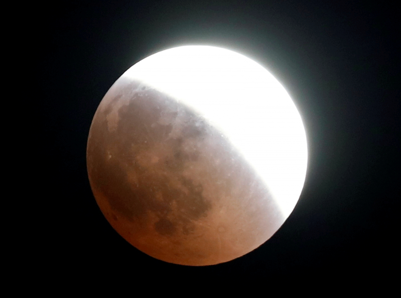 The moon is seen during a lunar eclipse over Cairo, Egypt July 27, 2018.