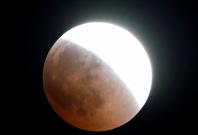 The moon is seen during a lunar eclipse over Cairo, Egypt July 27, 2018.