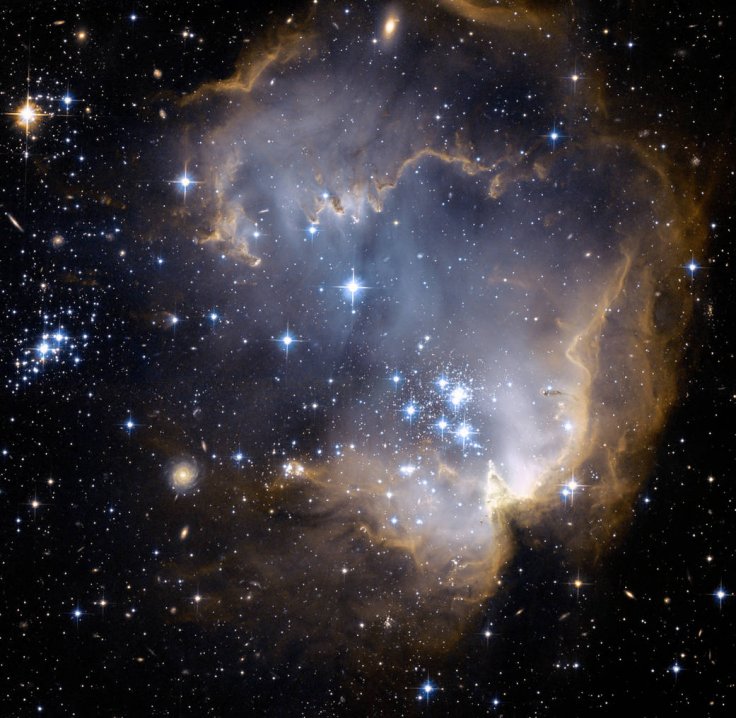 Near the outskirts of the Small Magellanic Cloud, a satellite galaxy some 200 thousand light-years distant, lies the young star cluster NGC 602.
