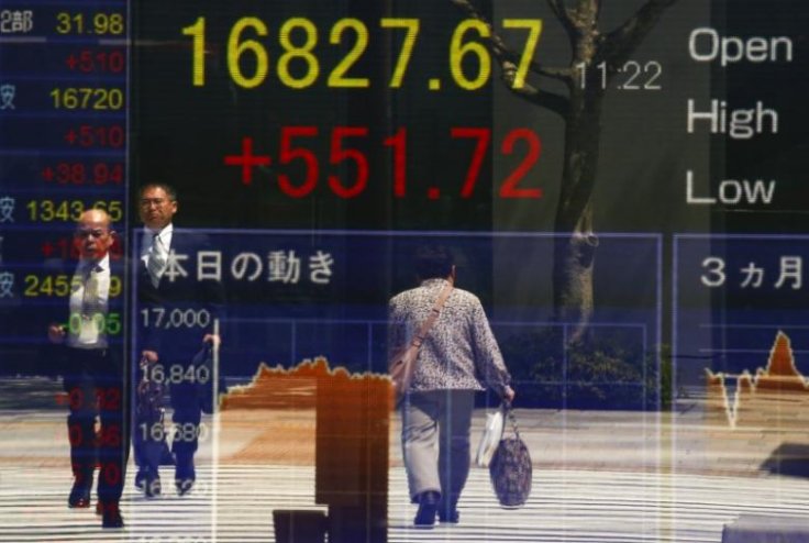 Asian stocks step back from one-year high after Fed rate talks