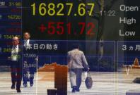 Asian stocks step back from one-year high after Fed rate talks