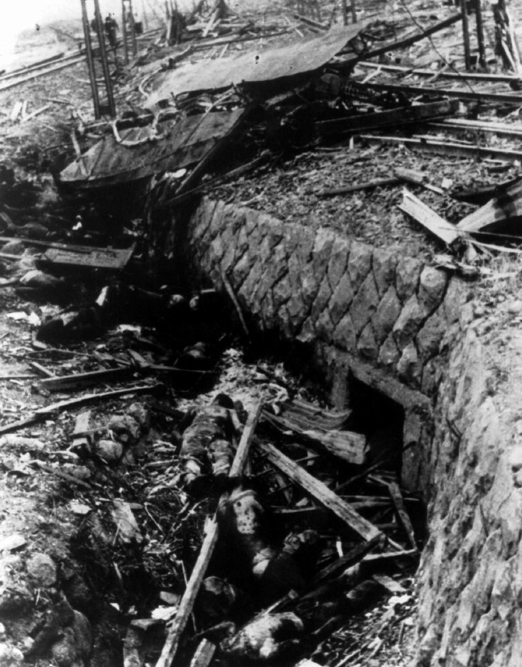 This August 1945 file photo from captured Japanese film shows victims of the atomic bomb who were thrown clear of a tramcar they were riding into a ditch near the the tracks, when the bomb was dropped on Nagasaki on August 9, 1945. The bomb, nicknamed 