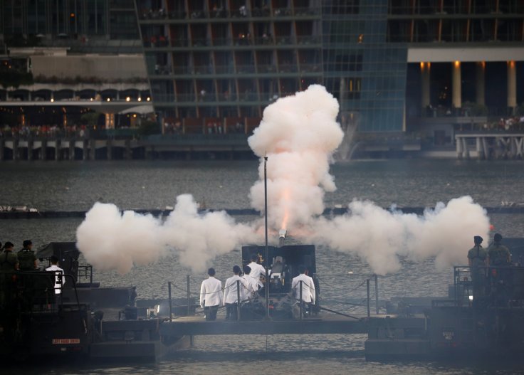 Howitzer is fired during a 21-gun salute at the National Day parade along Marina Bay in Singapore August 9, 2018.