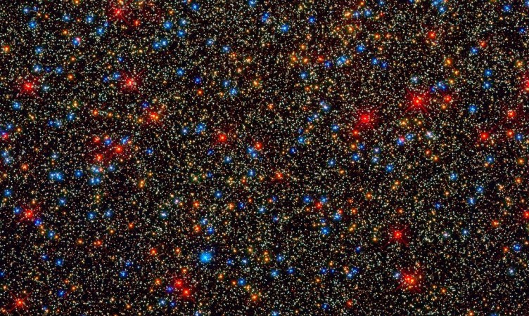 There are colorful stars galore, but likely no habitable planets, inside the globular star cluster 