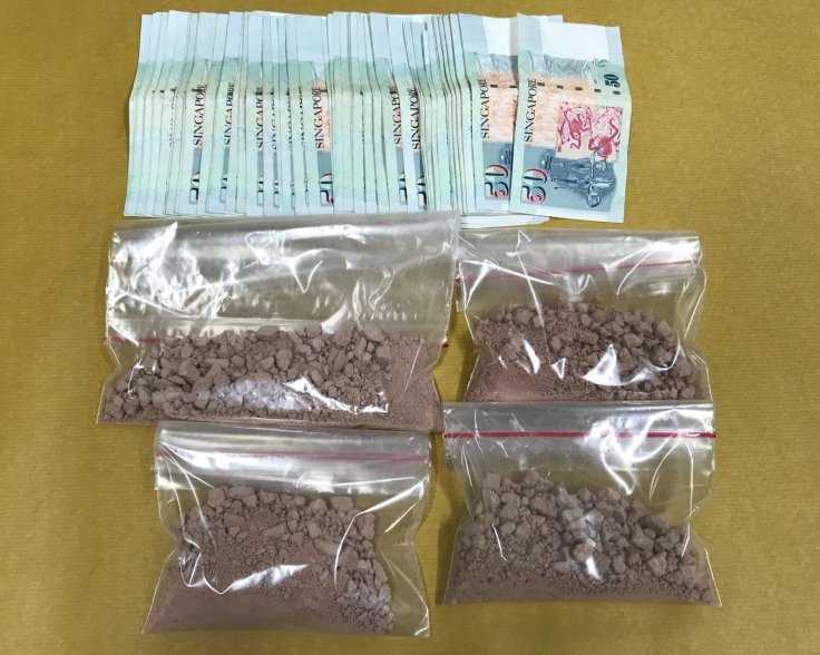 Heroin and cash seized in CNB operation on 15 August 2018. Heroin and cash seized in CNB operation on 15 August 2018.
