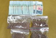 Heroin and cash seized in CNB operation on 15 August 2018. Heroin and cash seized in CNB operation on 15 August 2018.