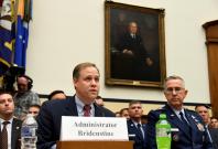 NASA Administrator Jim Bridenstine (L) makes remarks as US Strategic Command Commander Gen. John Hyten listens during the House Armed Services Strategic Forces Subcommittee's joint hearing with the House Science, Space and Technology Committee, in Washing