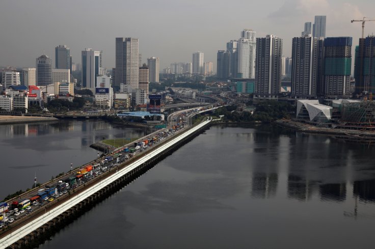 Pipes carrying water from Malaysia to Singapore run alongside the causeway towards the Woodlands Checkpoint in Singapore 