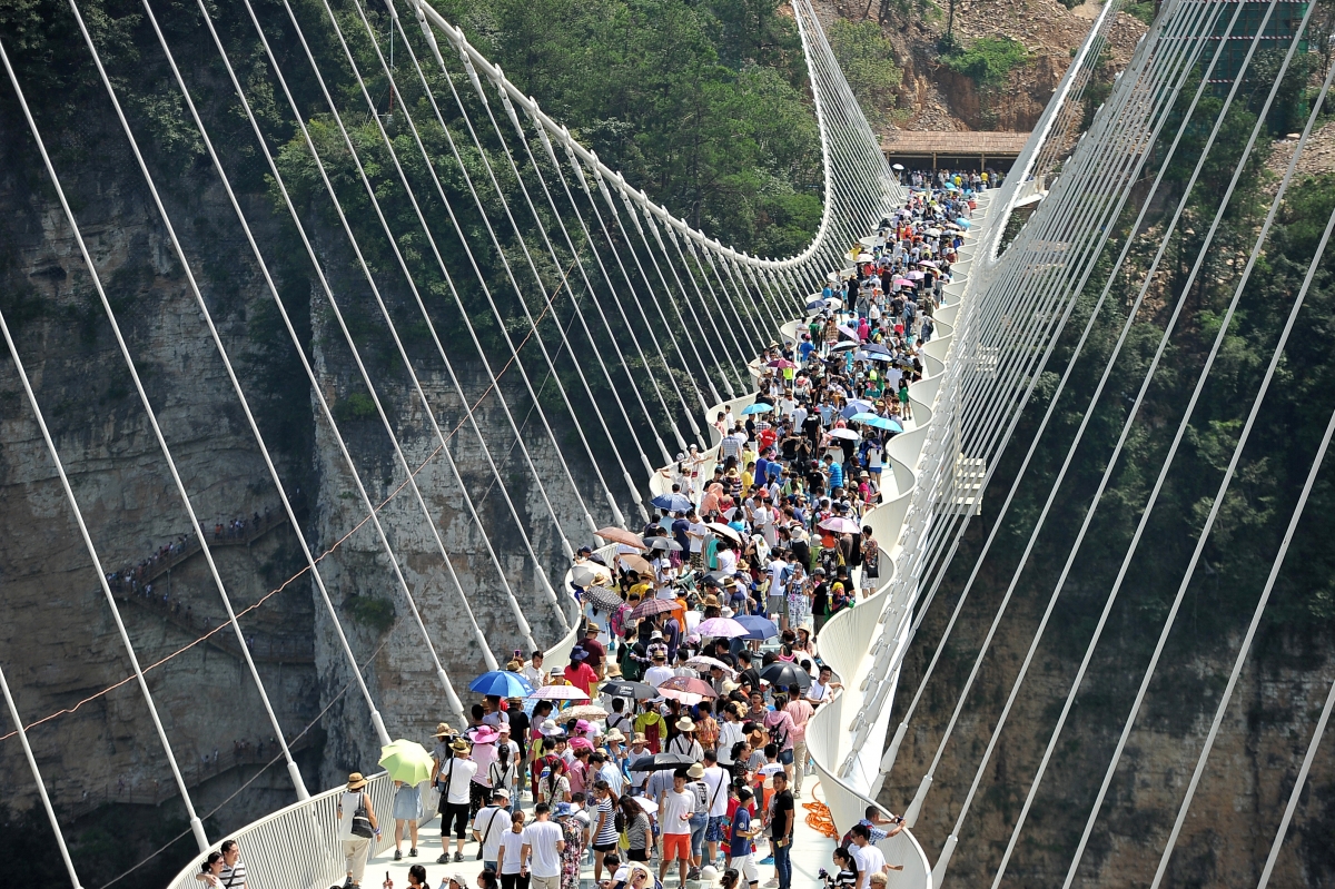 China opens world's highest and longest glass bridge for its visitors