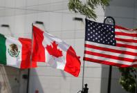 Flags of the U.S., Canada and Mexico fly next to each other in Detroit, Michigan, U.S. August 29, 2018. REUTERS/Rebecca Cook/File Photo