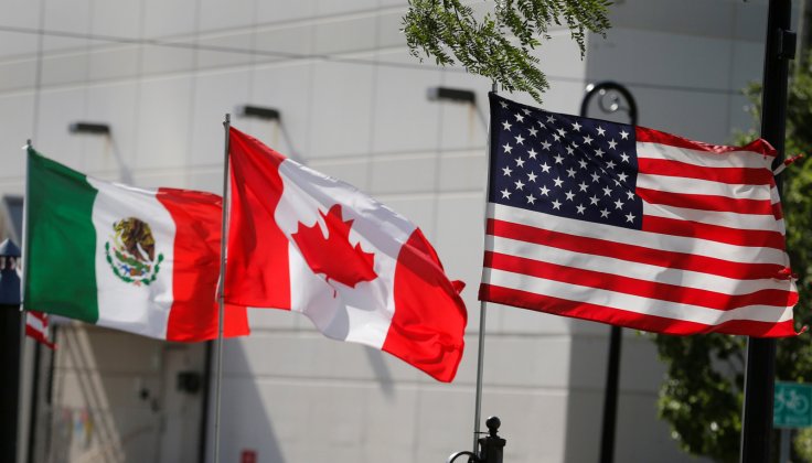 Flags of the U.S., Canada and Mexico fly next to each other in Detroit, Michigan, U.S. August 29, 2018. REUTERS/Rebecca Cook/File Photo