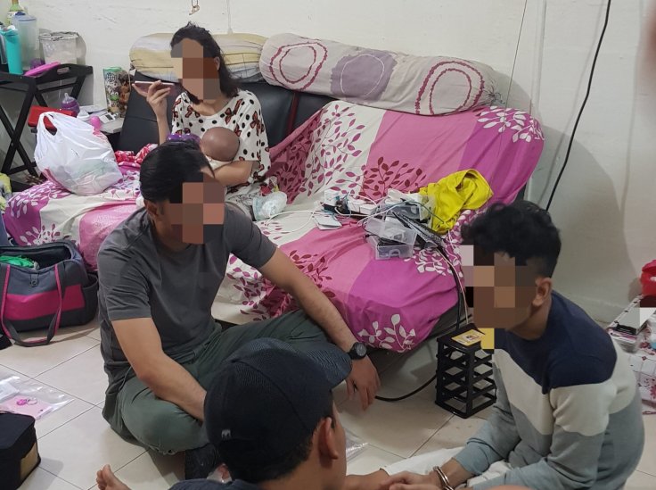 CNB officers interviewing 25-year-old male suspected drug trafficker at a unit in vicinity of Telok Blangah Crescent on 29 August 2018.  A three-month-old baby was in the unit with the mother, a 24-year-old suspected drug abuser.