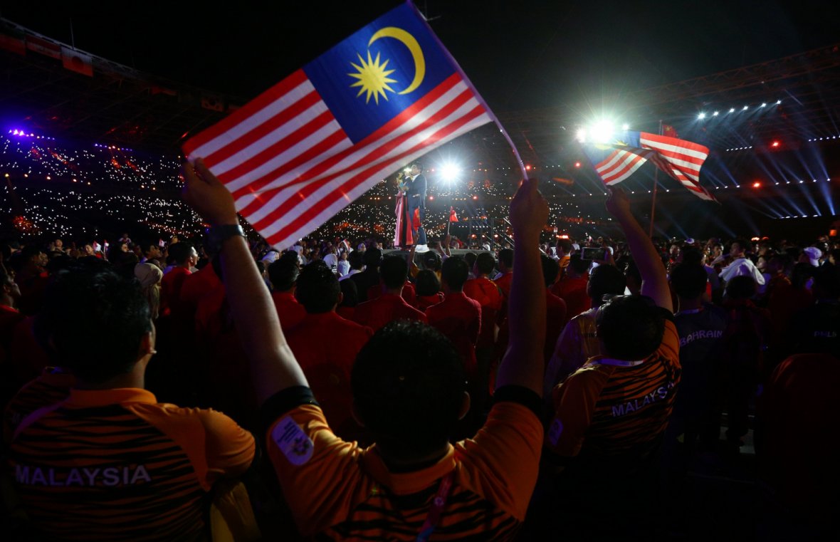 2018 Asian Games - Closing Ceremony - GBK Main Stadium - Jakarta, Indonesia - September 2, 2018 - The delegation of Malaysia watches artists perform during the closing ceremony. 