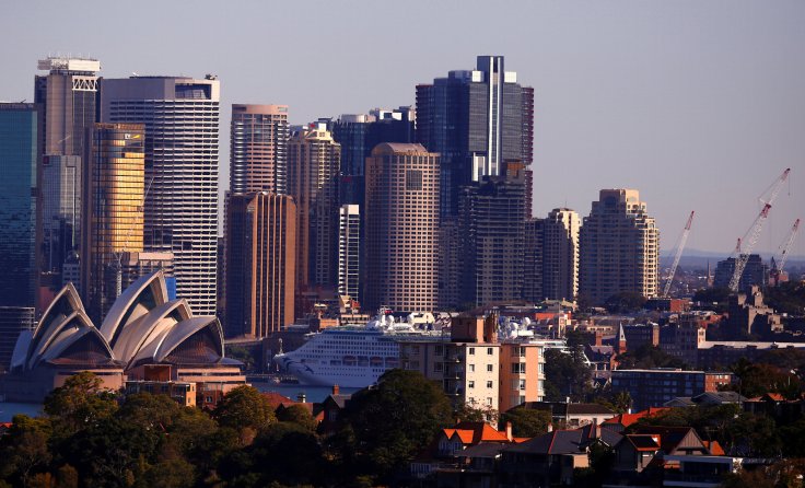 Cranes can be seen on a construction site at the inner-city suburb of Barangaroo, the site of the Australian casino operator Crown Resorts new Sydney waterfront resort, with the Sydney Opera House located on Sydney Harbour in Australia, August 9, 2018. RE