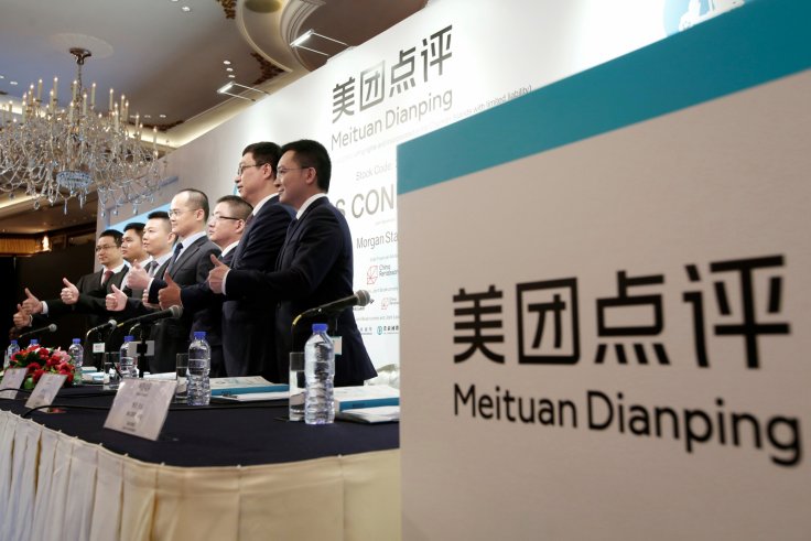 Management team of China's Meituan Dianping, an online food delivery-to-ticketing services platform, attend a news conference on its IPO in Hong Kong, China September 6, 2018.