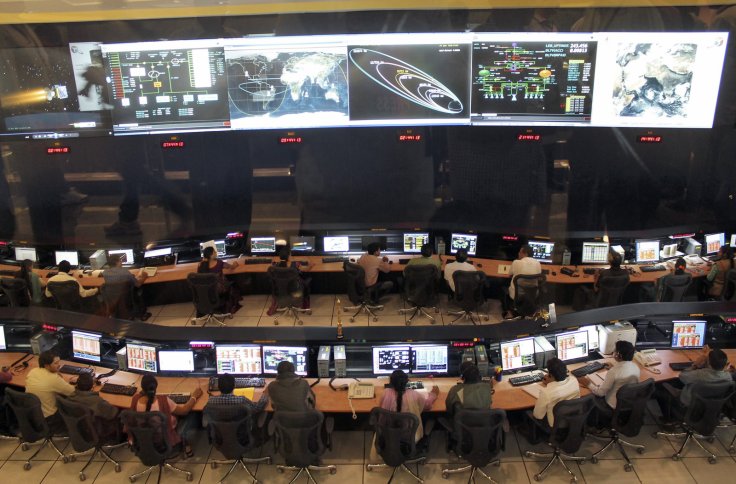 Indian Space Research Organization (ISRO) scientists and engineers monitor the movements of India's Mars orbiter at their Spacecraft Control Center in the southern Indian city of Bangalore November 27, 2013. 