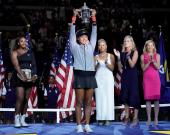 Naomi Osaka of Japan holds the U.S. Open trophy after beating Serena Williams of the USA in the women’s final on day thirteen of the 2018 U.S. Open tennis tournament at USTA Billie Jean King National Tennis Center. Mandatory Credit: Robert Deutsch-USA TOD