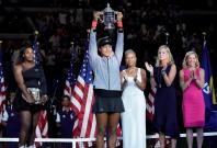 Naomi Osaka of Japan holds the U.S. Open trophy after beating Serena Williams of the USA in the women’s final on day thirteen of the 2018 U.S. Open tennis tournament at USTA Billie Jean King National Tennis Center. Mandatory Credit: Robert Deutsch-USA TOD