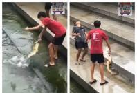 The two boys who were filmed fishing at Merlion Park The two boys who were filmed fishing at Merlion Park