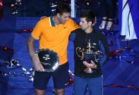 (L-R) Juan Martin Del Potro of Argentina and Novak Djokovic of Serbia poses with the runner-up and championship trophies (respectively) on day fourteen of the 2018 U.S. Open tennis tournament at USTA Billie Jean King National Tennis Center. Mandatory Cred