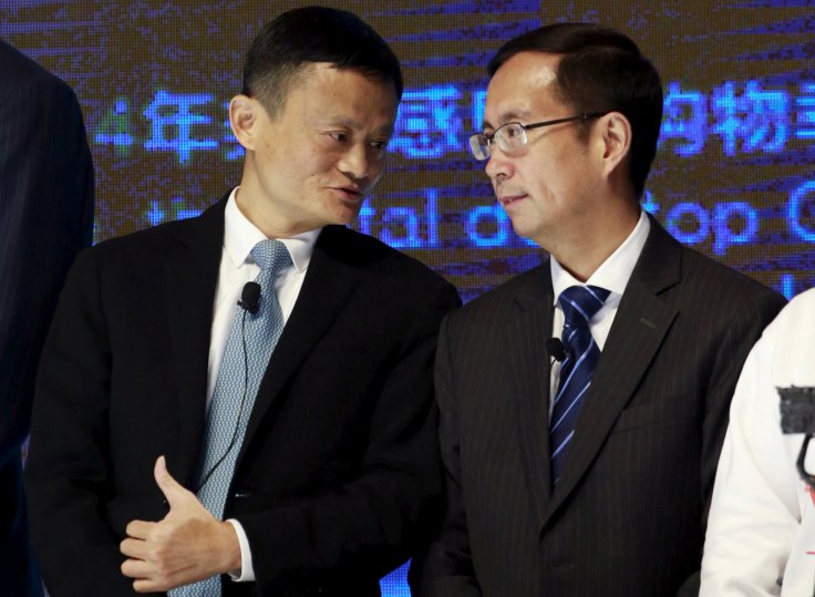 Alibaba Founder and Chairman Jack Ma (L) talks to CEO Daniel Zhang at NYSE Bell Ringing ceremony during Alibaba Group's 11.11 Global shopping festival in Beijing, China, November 11, 2015. REUTERS/Kim Kyung-Hoon/File Photo