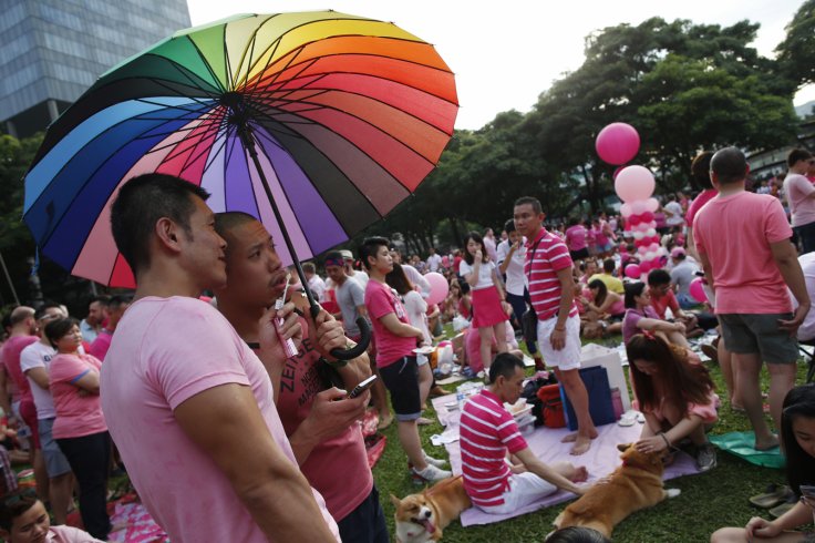 Participants dressed in pink enjoy a picnic before taking part in the forming of a giant pink dot at the Speakers' Corner in Hong Lim Park in Singapore June 28, 2014. The annual Pink Dot Sg event promotes an acceptance of the Lesbian, Gay, Bisexual and Tr