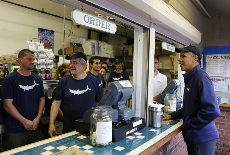 U.S. President Barack Obama orders lunch at Nancy's restaurant at Oak Bluffs at Martha's Vineyard, August 13, 2013. REUTERS/Larry Downing/File Photo