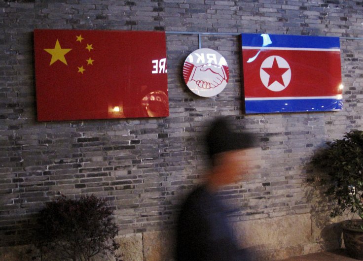 Flags of China and North Korea are seen outside the closed Ryugyong Korean Restaurant in Ningbo, Zhejiang province, China, in this April 12, 2016 file photo. REUTERS/Joseph Campbell/Files