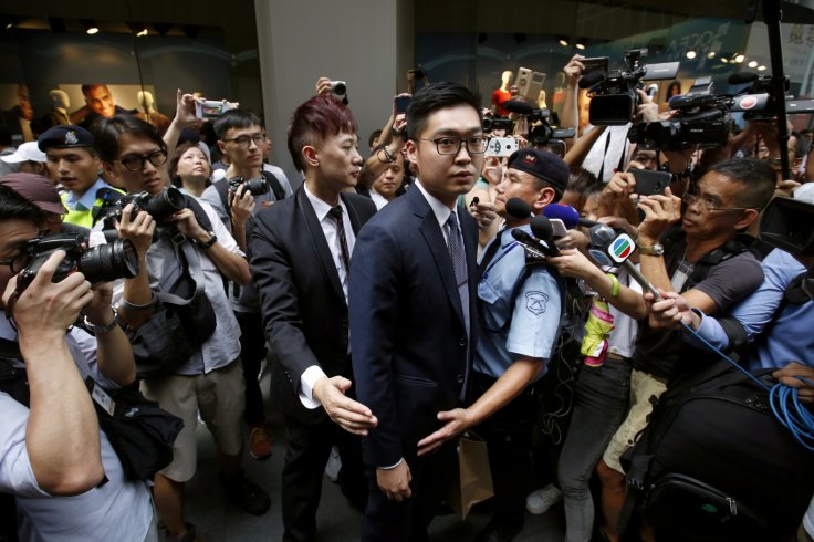 Andy Chan, a founder of the Hong Kong National Party, is surrounded by photographers as he leaves the Foreign Correspondents' Club in Hong Kong, China August 14, 2018. REUTERS/Bobby Yip