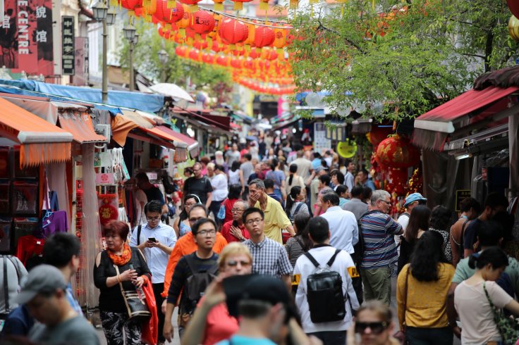 People walk through Chinatown in Singapore