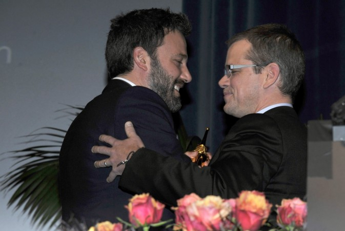 Director Ben Affleck (L) receives the Modern Master Award from actor Matt Damon at the 28th Santa Barbara International Film Festival in Santa Barbara, California 