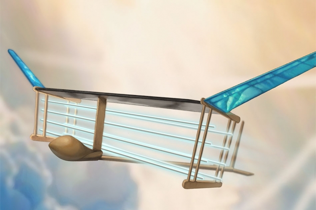A new MIT plane is propelled via ionic wind. Batteries in the fuselage (tan compartment in front of plane) supply voltage to electrodes (blue/white horizontal lines) strung along the length of the plane, generating a wind of ions that propels the plane fo