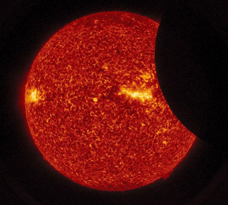 White dwarf stars, which our Sun will eventually become, will become a solid crystal, according to new research. Pictured: In this NASA handout, the Moon transits across the Sun, as seen in 304 angstrom extreme ultraviolet light during the total eclipse M