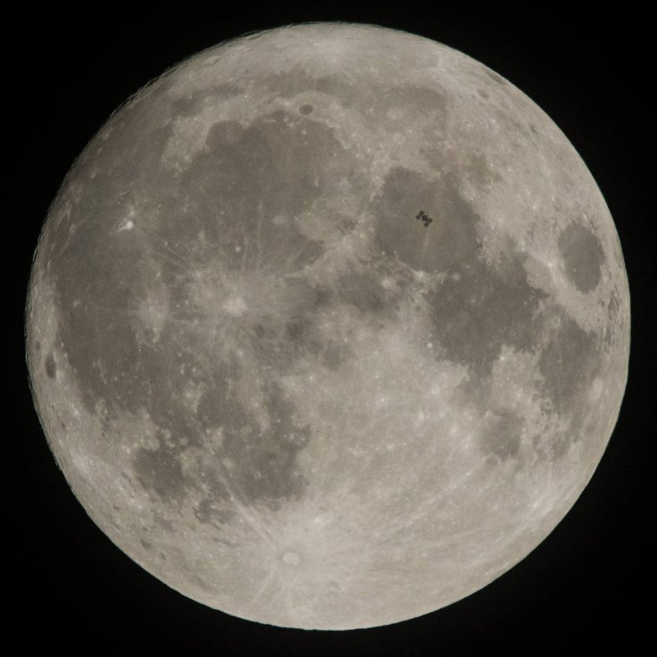 The International Space Station, with a crew of six onboard, is seen in silhouette as it transits the Moon at roughly five miles per second, Saturday, Dec. 2, 2017, in Manchester Township, York County, Pennsylvania. Onboard are: NASA astronauts Joe Acaba,