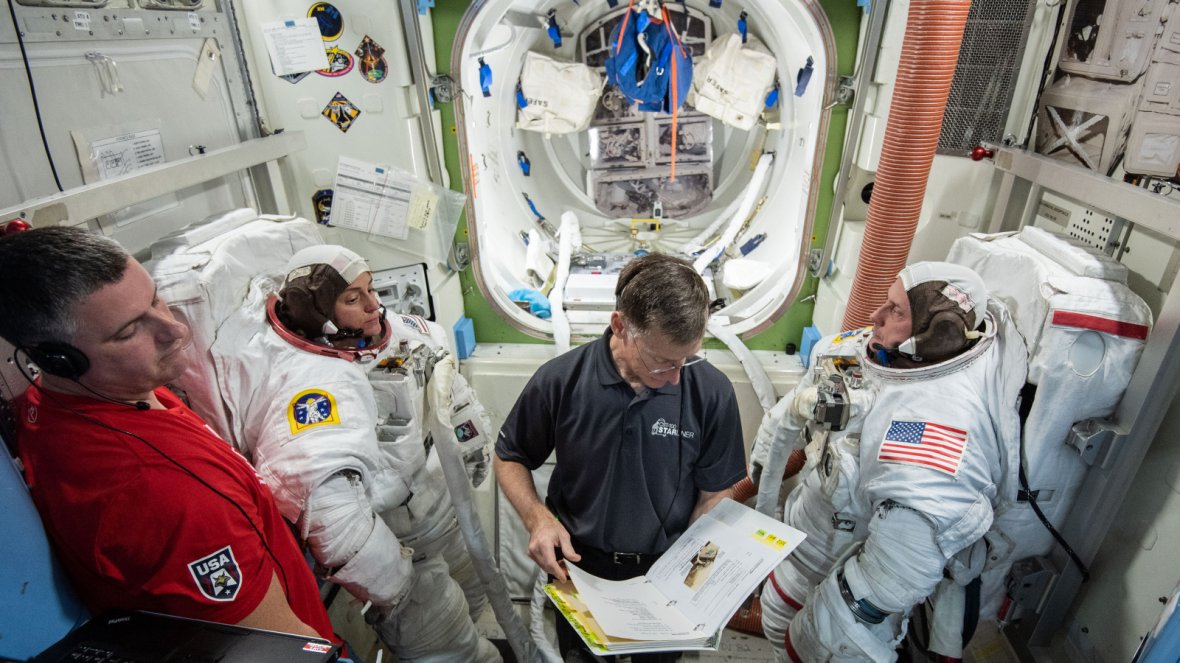 This preflight image from Feb. 6, 2019, shows NASA astronauts Mike Fincke and Nicole Mann and Boeing astronaut Chris Ferguson during spacewalk preparations and training inside the Space Station Airlock Mockup at NASA's Johnson Space Center in Houston.  Th