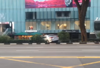 Taxi mounts Orchard Road Taxi mounts Orchard Road