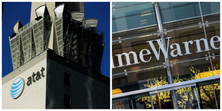 (L) An AT&T logo and communication equipment is shown on a building in downtown Los Angeles, California October 29, 2014 and (R): The Time Warner building is pictured in New York, New York December 11, 2013. The $85-billion deal will enable AT&T to expand