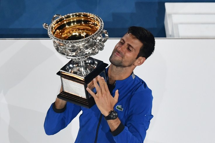  Novak Djokovic of Serbia holds up the trophy during the trophy awarding ceremony after the men's singles final match between Novak Djokovic of Serbia and Rafael Nadal of Spain at 2019 Australian Open in Melbourne, Australia, Jan. 27, 2019. (Xinhua/Bai Xu