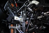 LOS ANGELES, June 1, 2014 (Xinhua) -- Surrendered handguns are displayed at a gun buyback event in Los Angeles, the United States, on May 31, 2014. People can exchange their firearms at four Los Angles-area locations for supermarket gift cards. The Citywi