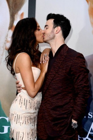 Danielle Jonas and Kevin Jonas kiss at Chasing Happiness premiere.Instagram