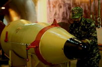 A member of the Iranian Revolutionary Guards checks a missile inside an underground depot in an undisclosed location, Iran, in this handout photo released by the official website of Islamic Revolutionary Guard Corps (IRGC) on March 8, 2016