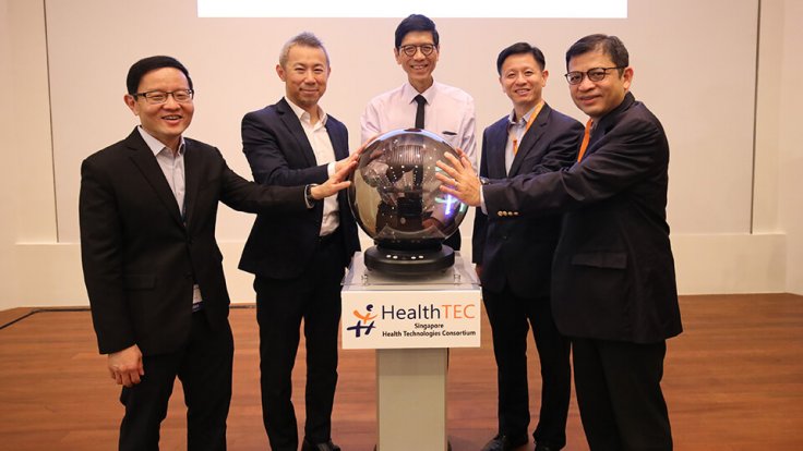 From left: Prof Lim; Prof Chen; Prof Tan;  Mr Lim Tuang Liang, Executive Director of the Research, Innovation and Enterprise Coordination Office at NRF; and Mr George Loh, Director of Services and Digital Economy at the National Research Foundation, offic